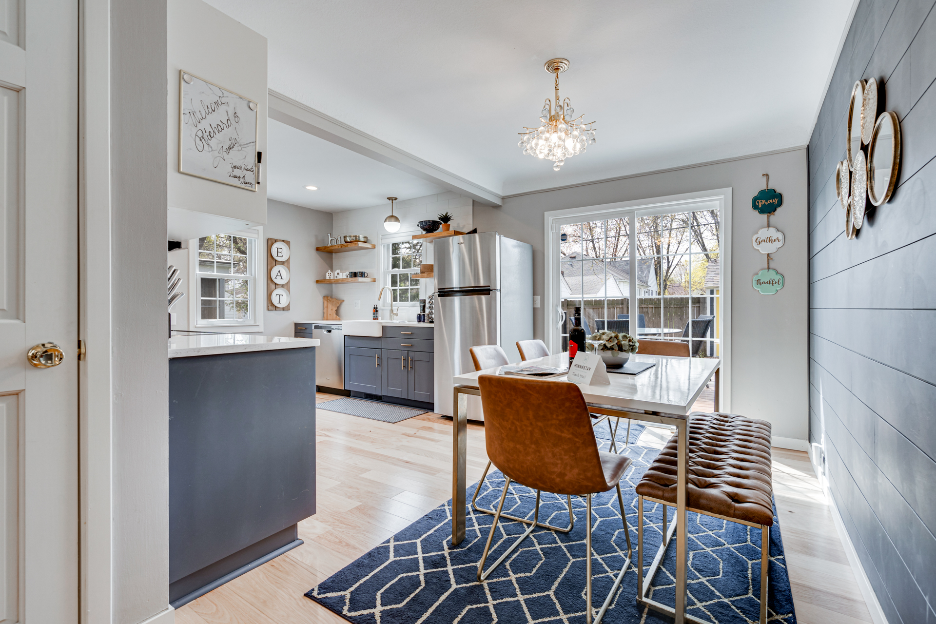 Modern dining area with a stylish kitchen view.