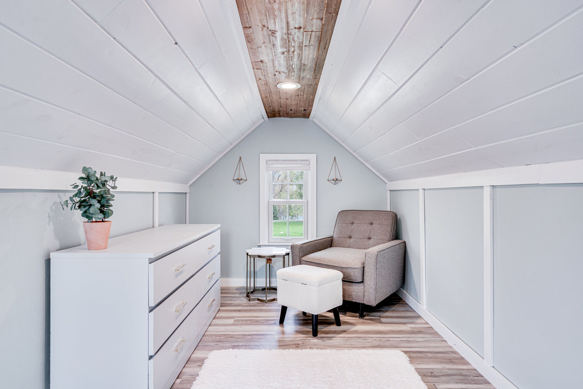 Cozy attic space with modern decor and natural light.