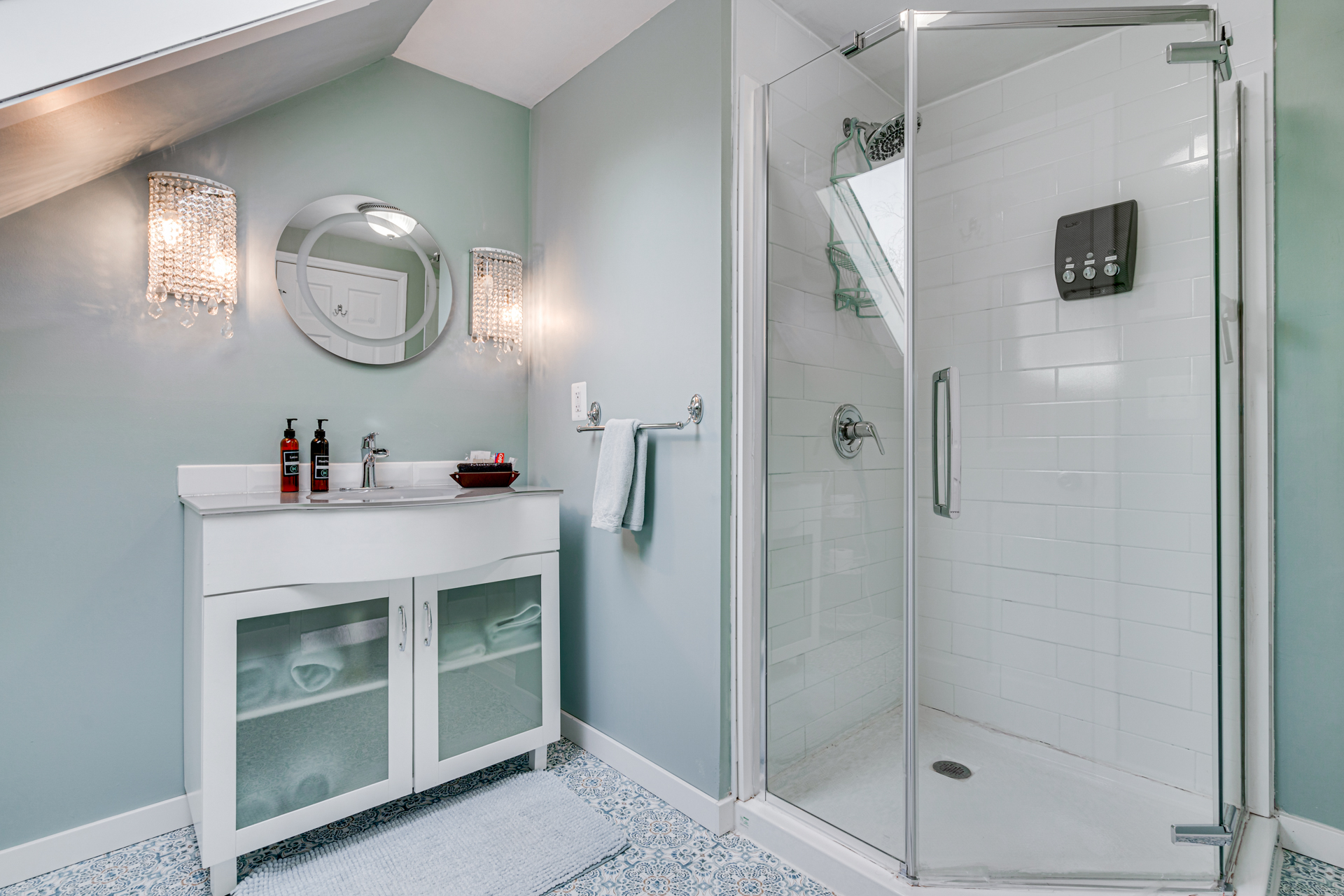 A stylish modern bathroom featuring a glass shower and elegant vanity.