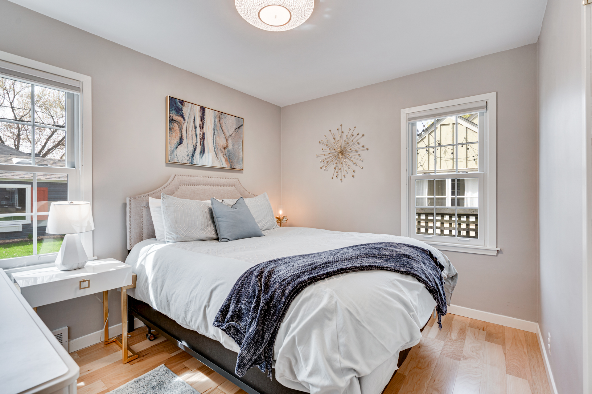A modern and cozy bedroom with elegant decor and natural light.