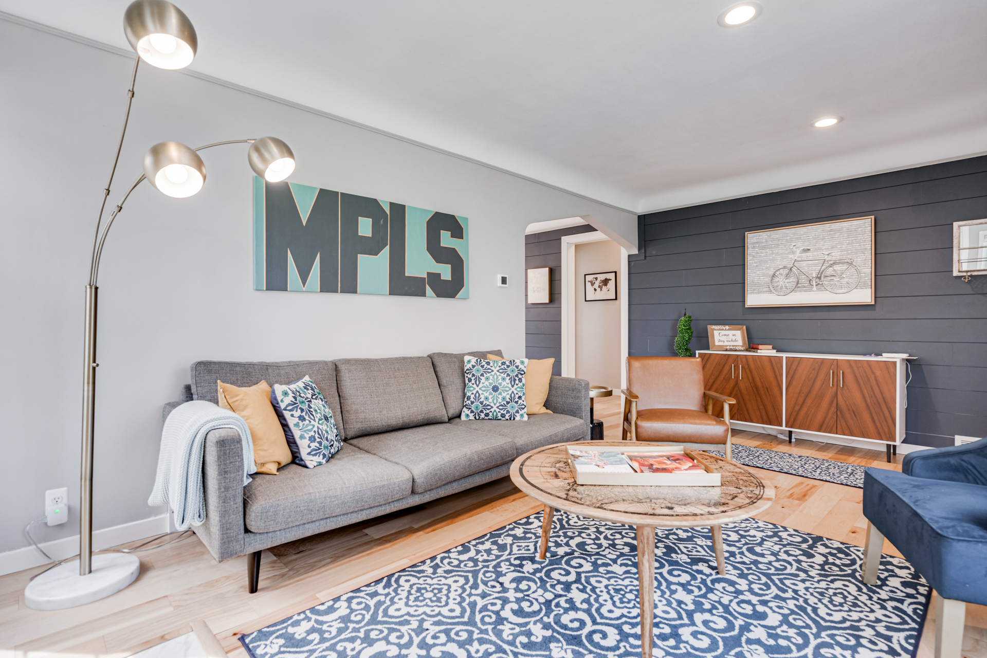 A stylish living room with modern decor and personal touches.