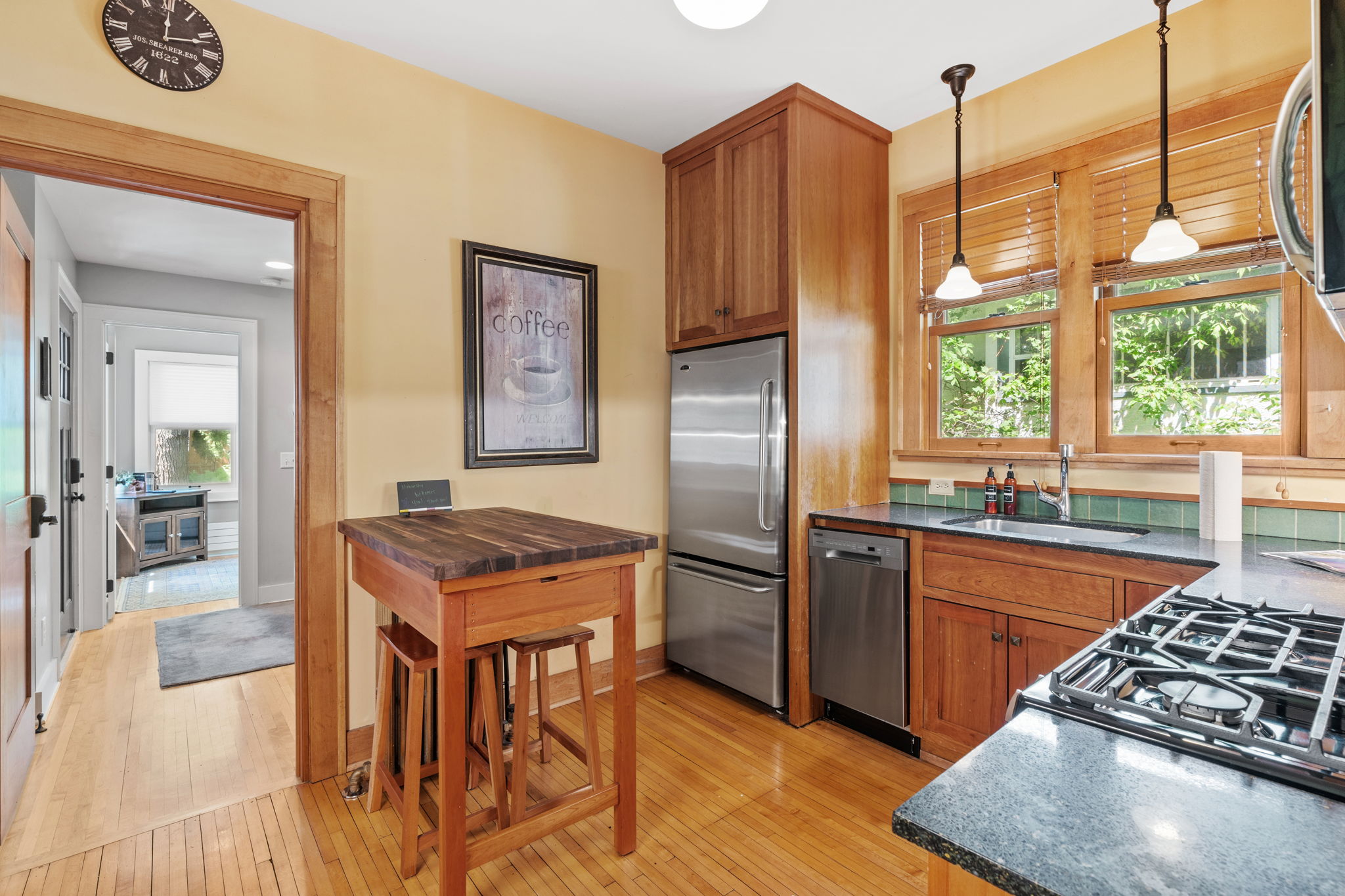 A cozy kitchen blending modern and traditional styles with warm wooden tones.