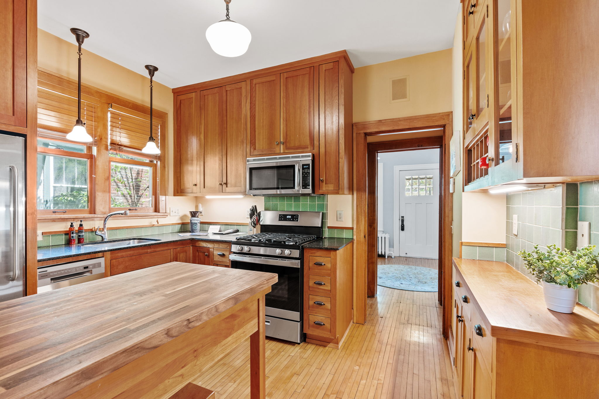 A charming kitchen featuring warm wood tones and natural light.