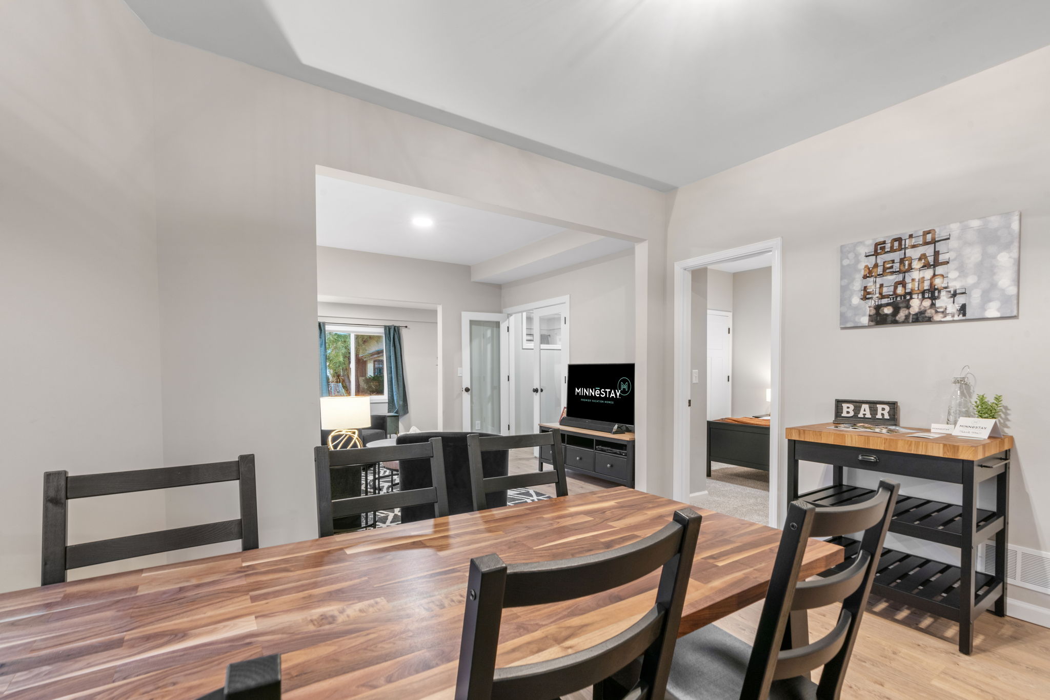 A warm and inviting open-concept dining area transitioning into a living space.