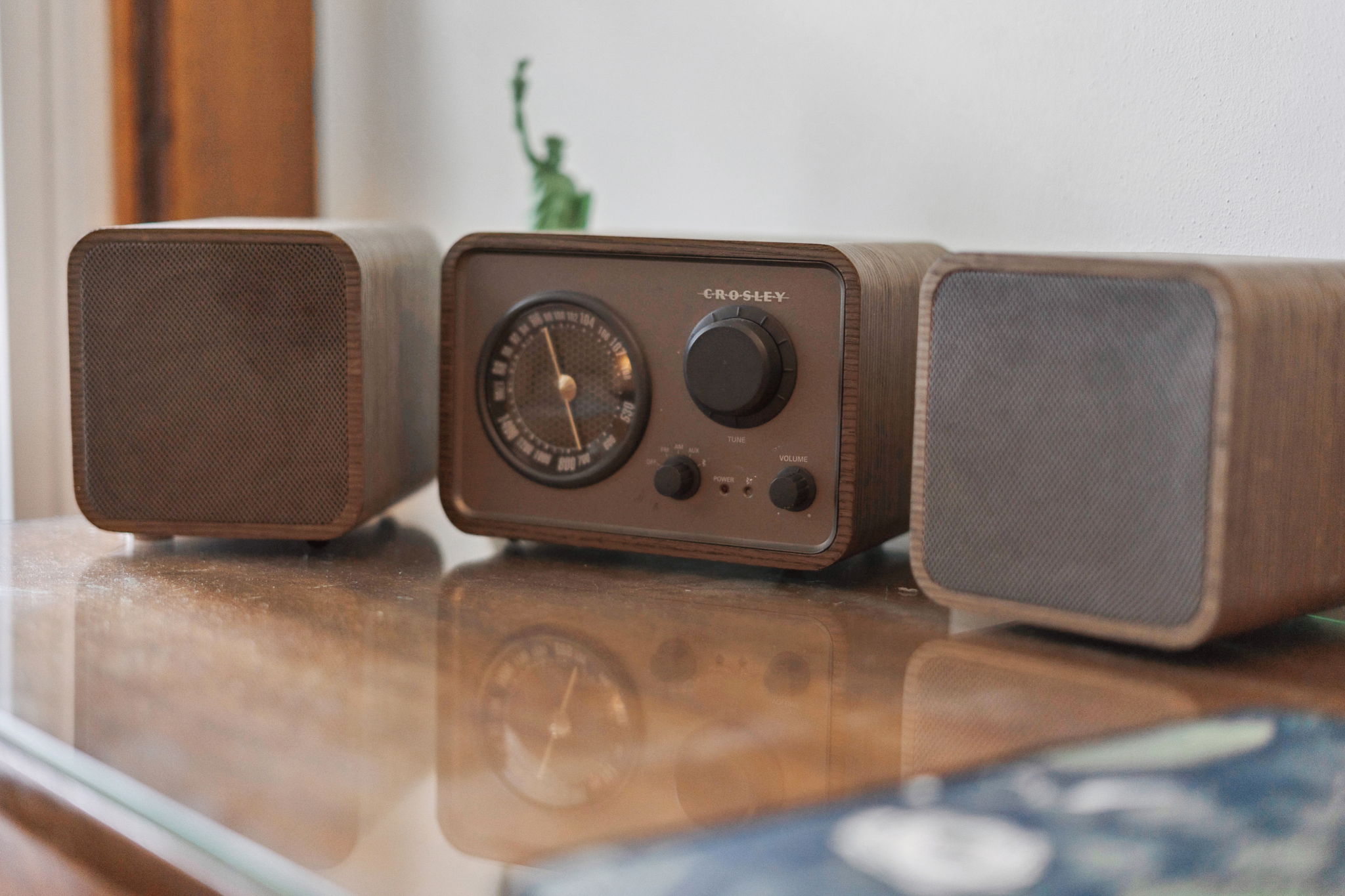 Vintage Crosley radio and speakers on a wooden surface.