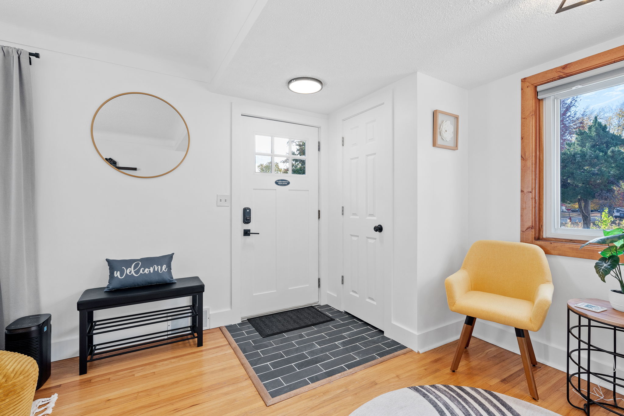 A bright and welcoming entryway featuring modern decor and inviting elements.
