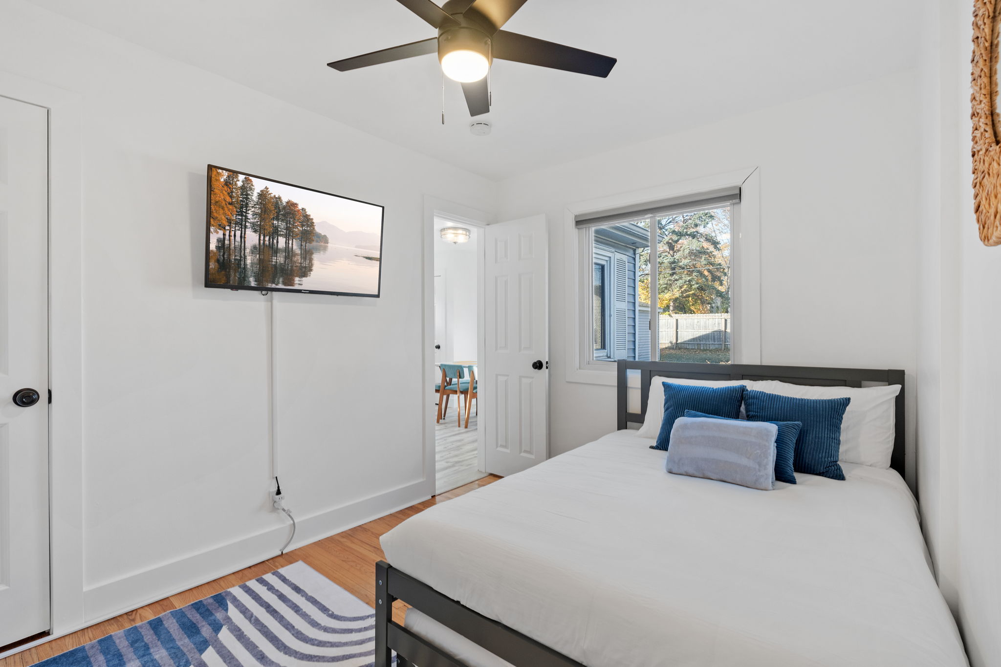 A modern, cozy bedroom featuring a minimalistic design.