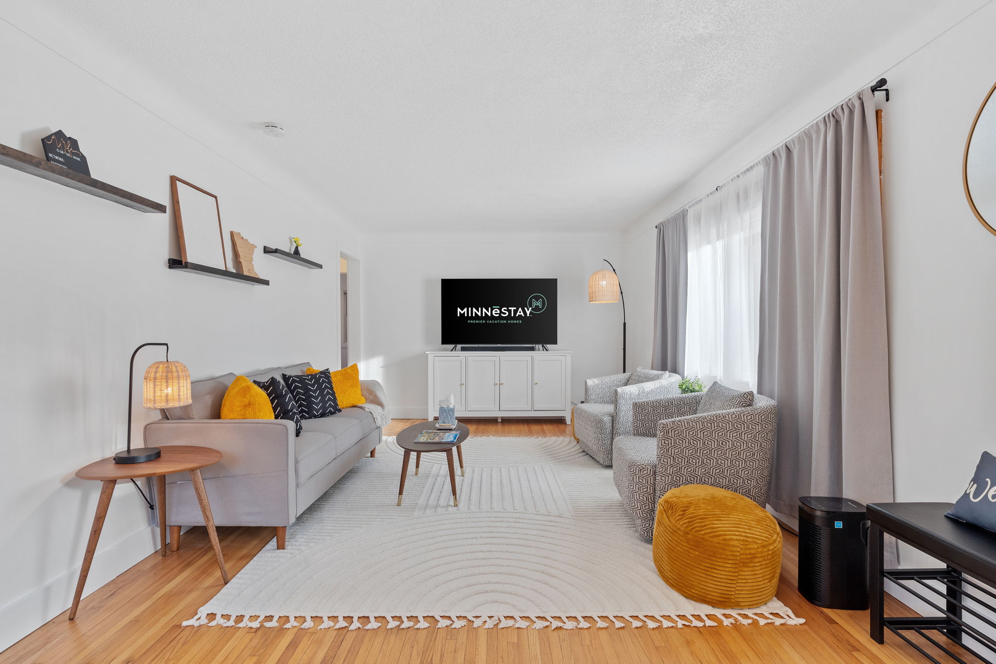 A stylish and inviting living room with modern decor and comfortable seating.