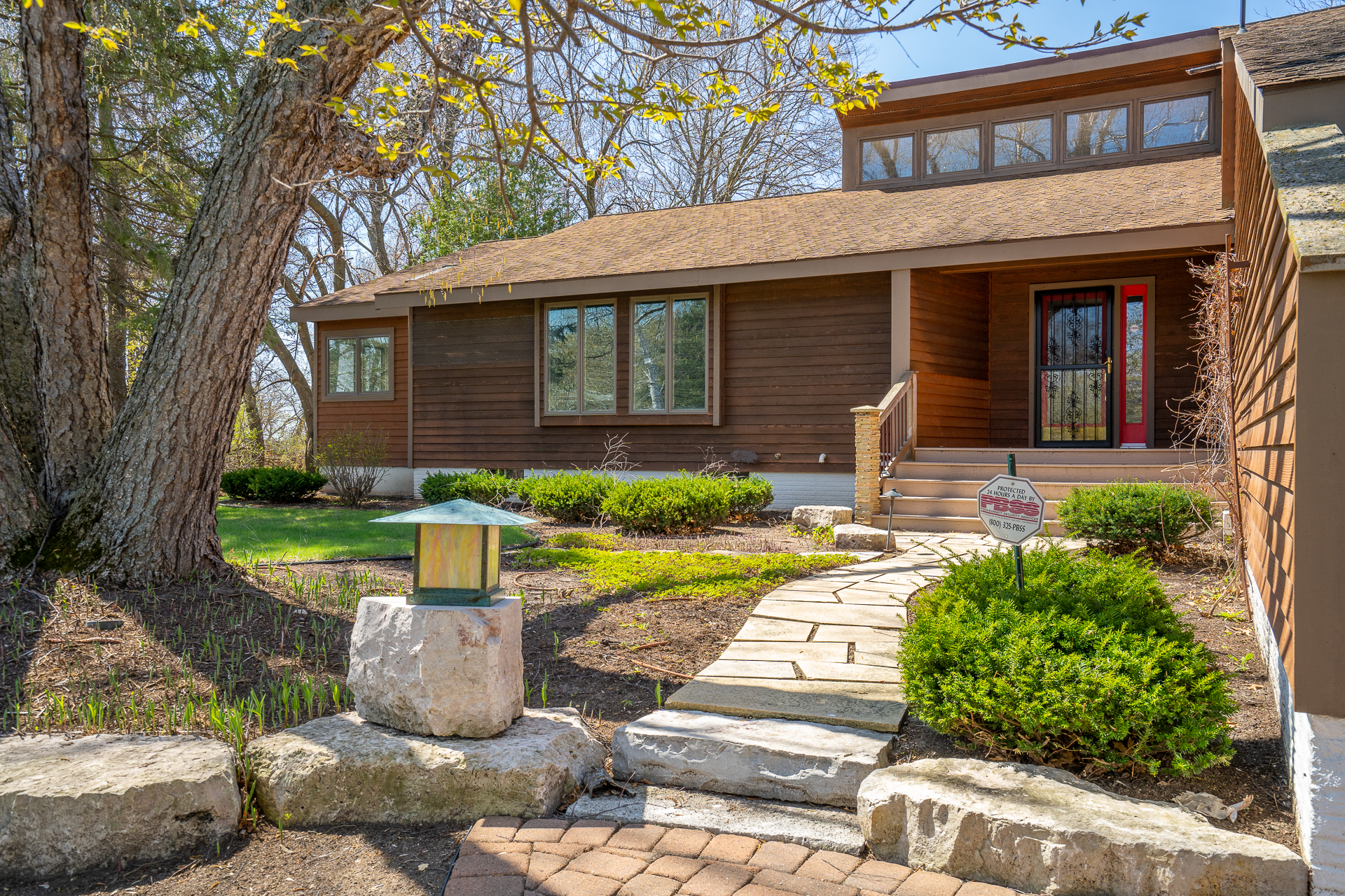 Welcoming front view of a contemporary home with inviting garden.