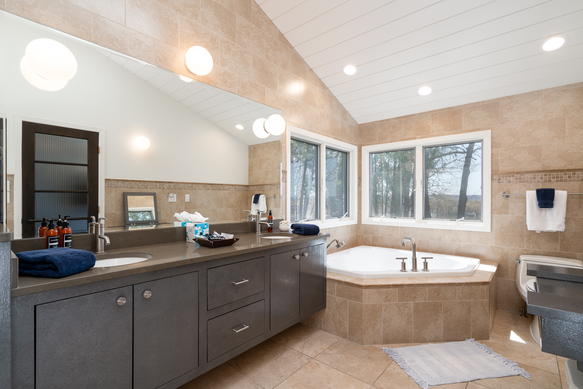 A modern bathroom with elegant fixtures and a serene view.