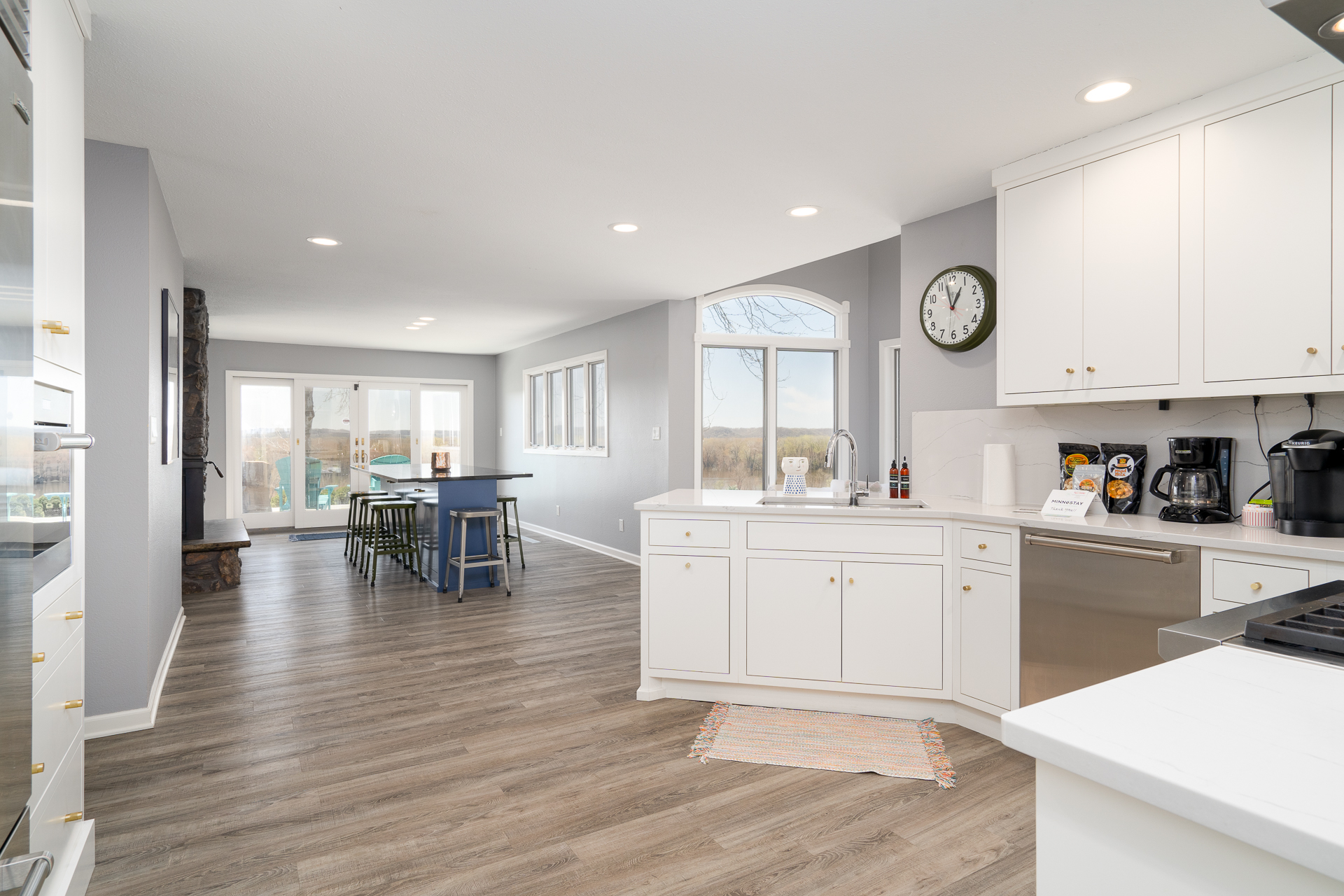 Modern kitchen and dining space with natural lighting and vibrant decor.