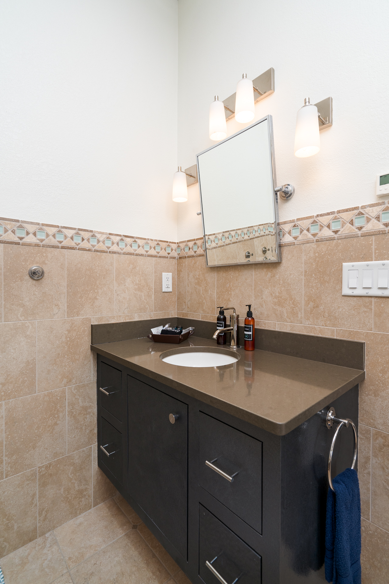 A modern bathroom with sleek design and elegant features.