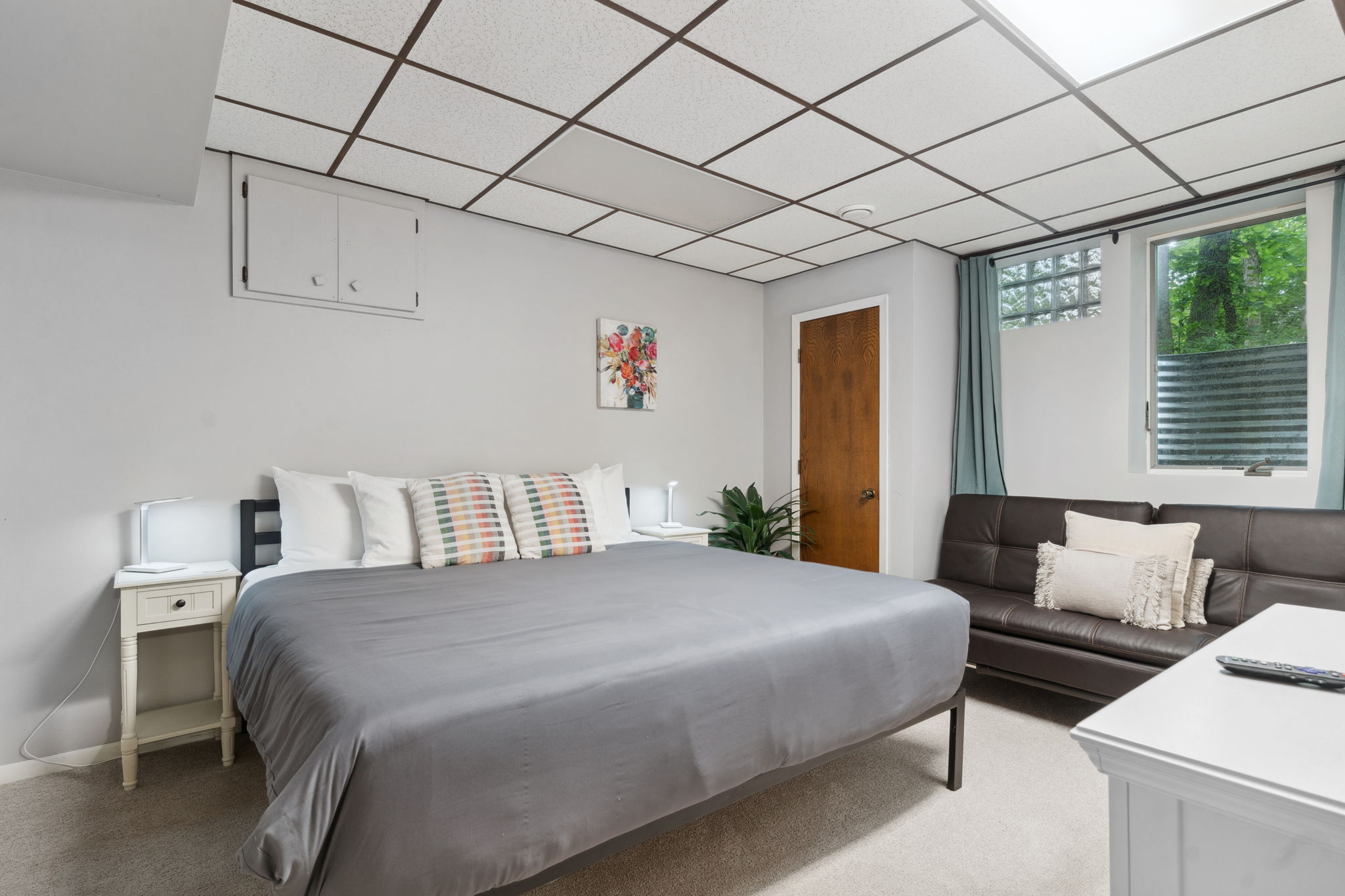 A cozy bedroom featuring a large bed, stylish decor, and a relaxing atmosphere.