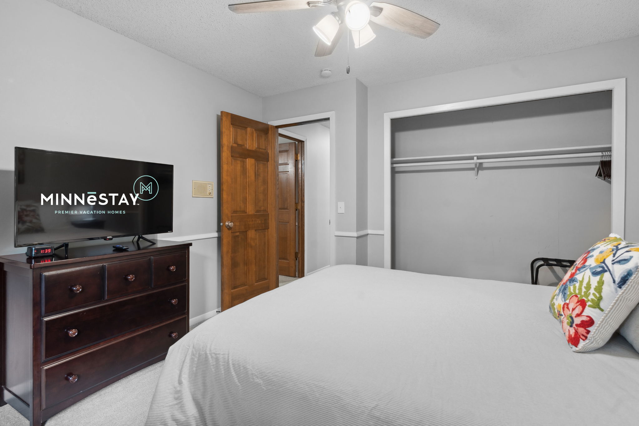 Cozy bedroom with modern amenities and inviting decor.