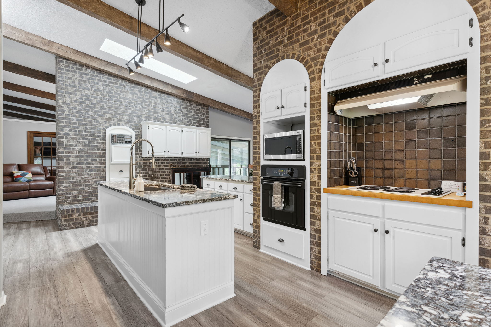 A modern kitchen blending rustic and contemporary design elements.