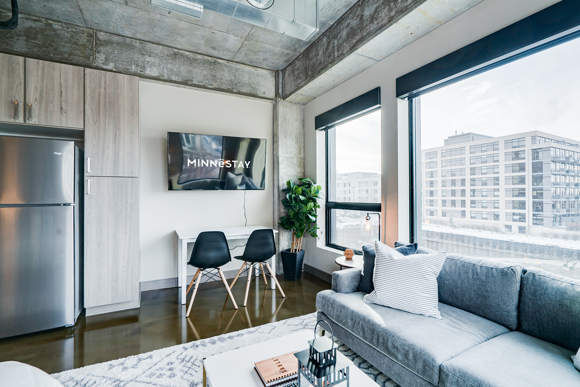 A modern living space with industrial elements and cozy decor.