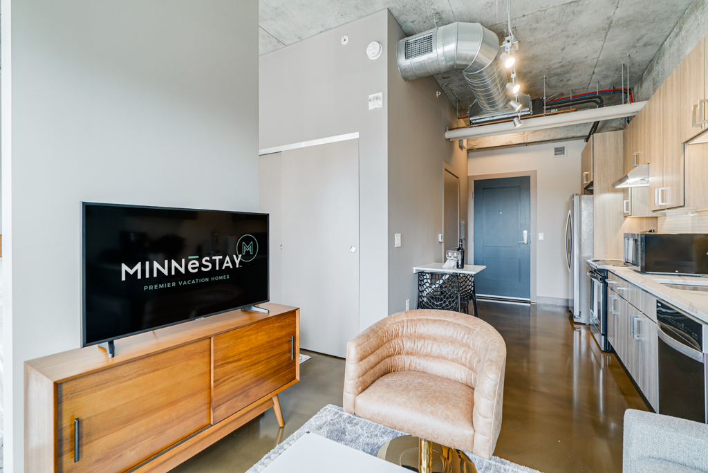 Modern interior of a vacation rental featuring stylish furnishings and kitchen.