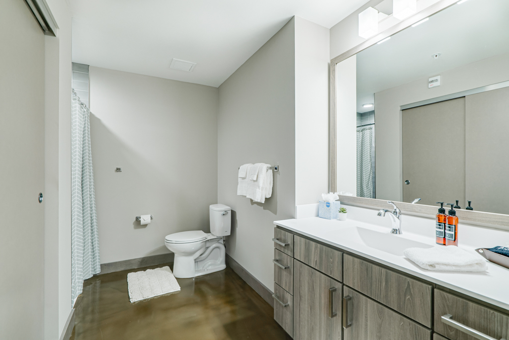 A modern, minimalist bathroom with sleek fixtures and a soothing color palette.