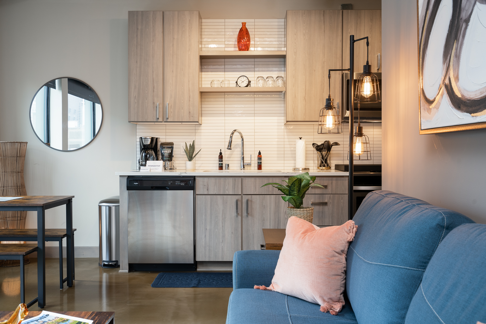 Modern kitchen and living area featuring sleek design and cozy decor.