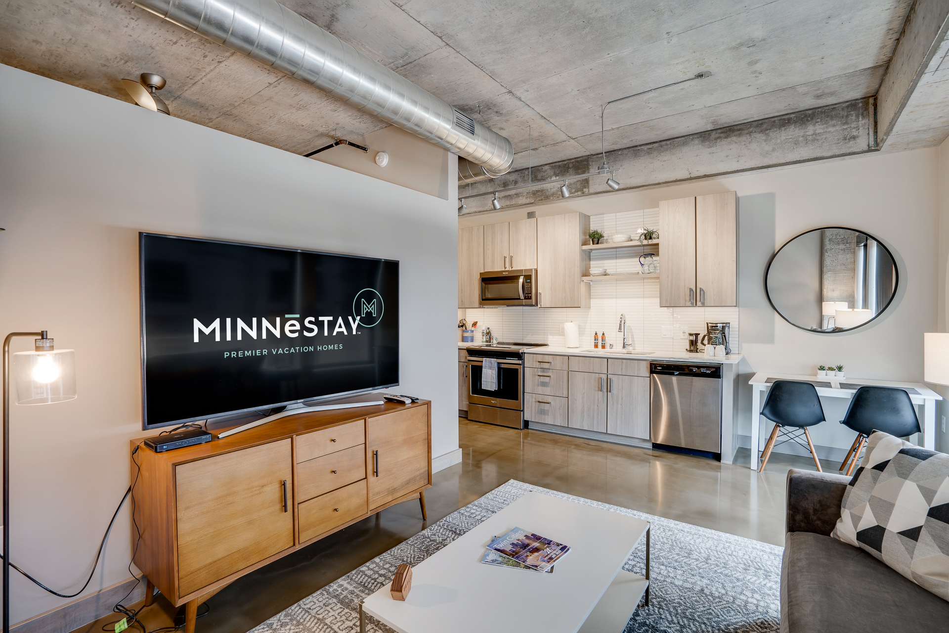 Stylish living area with a modern kitchen and cozy furniture in a vacation home.
