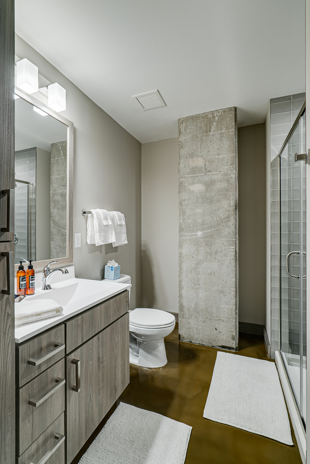 A modern minimalist bathroom with an industrial touch.