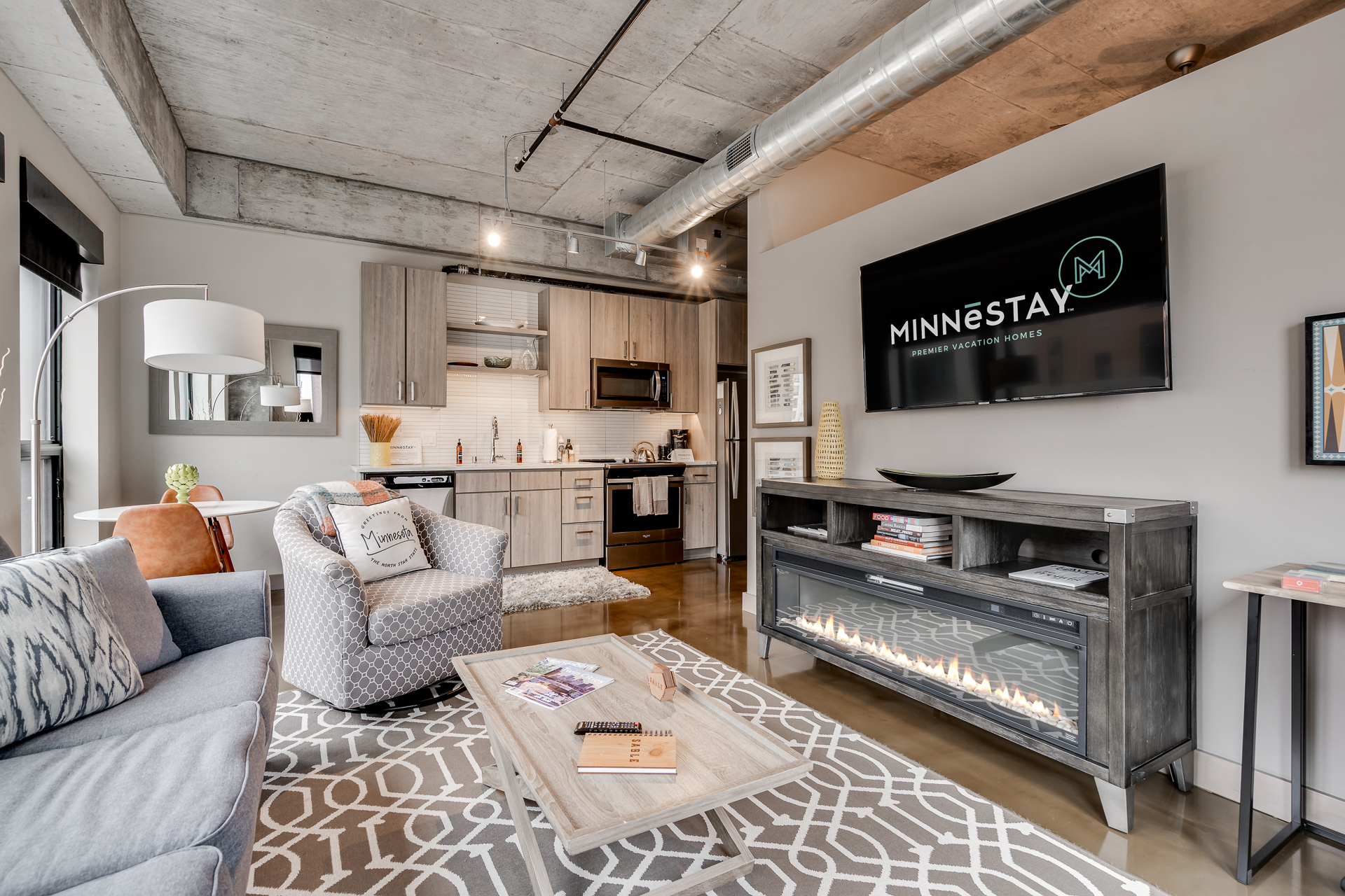 A stylish urban apartment living room featuring modern decor and a cozy atmosphere.