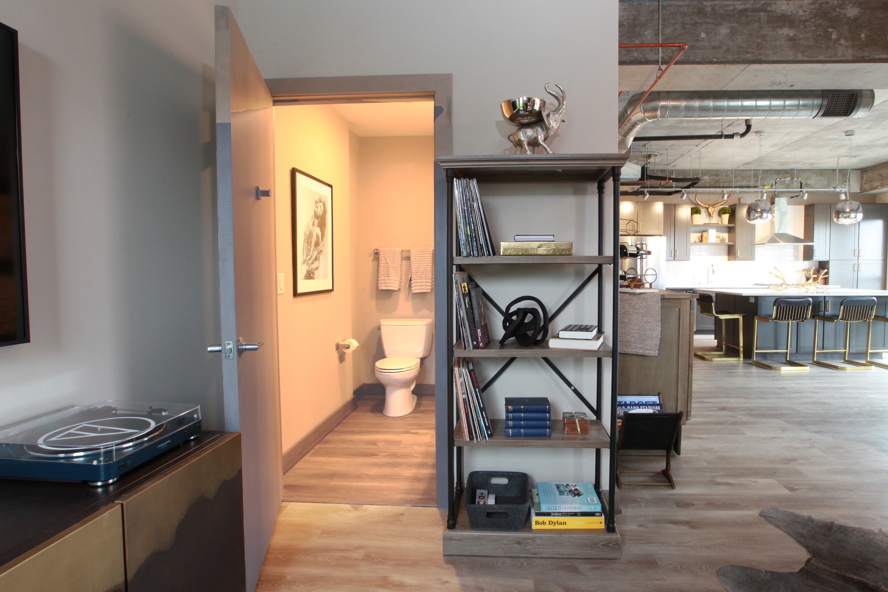 A contemporary living space showcasing a cozy living area and modern kitchen.