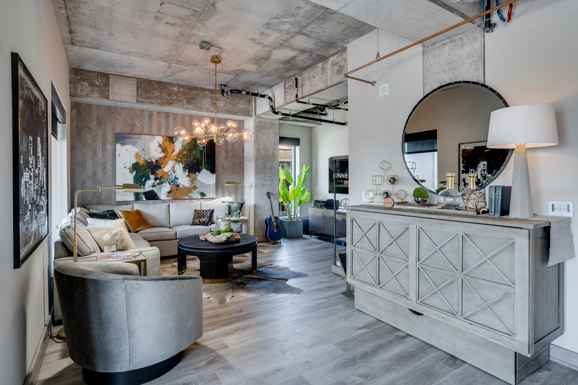 A modern and stylish living room featuring a blend of comfort and contemporary design.