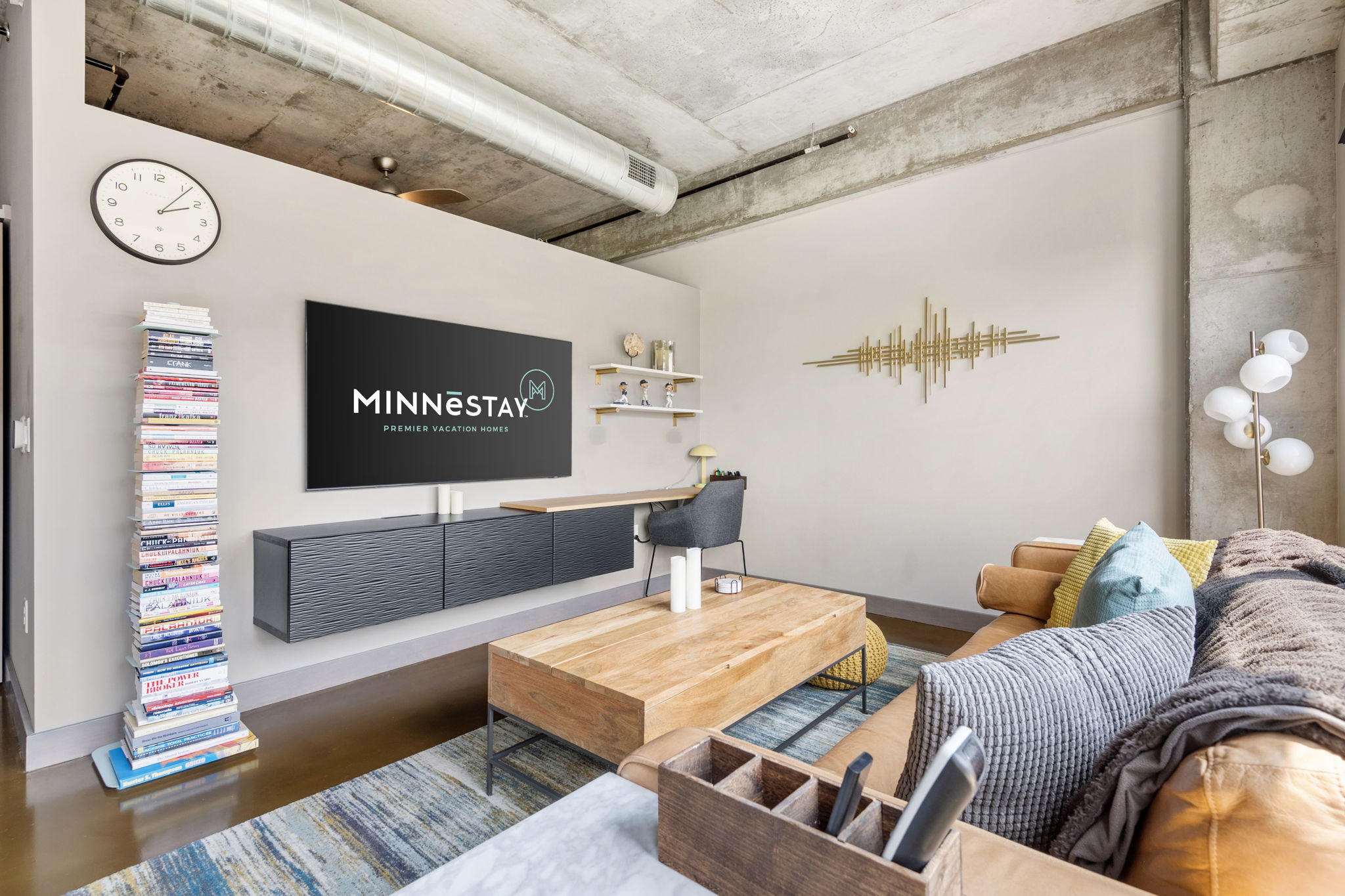 Stylish contemporary living room with industrial elements and warm decor.