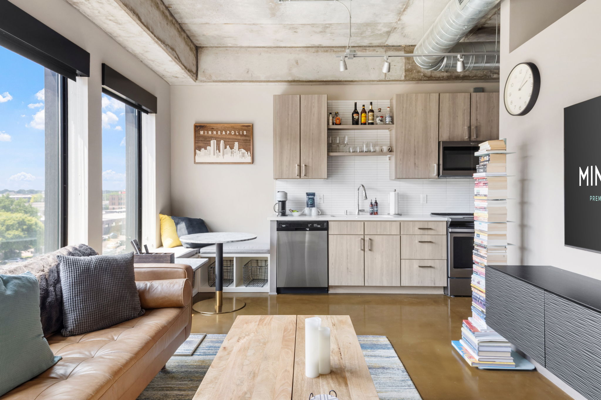 A modern apartment interior featuring a stylish living space and kitchen.