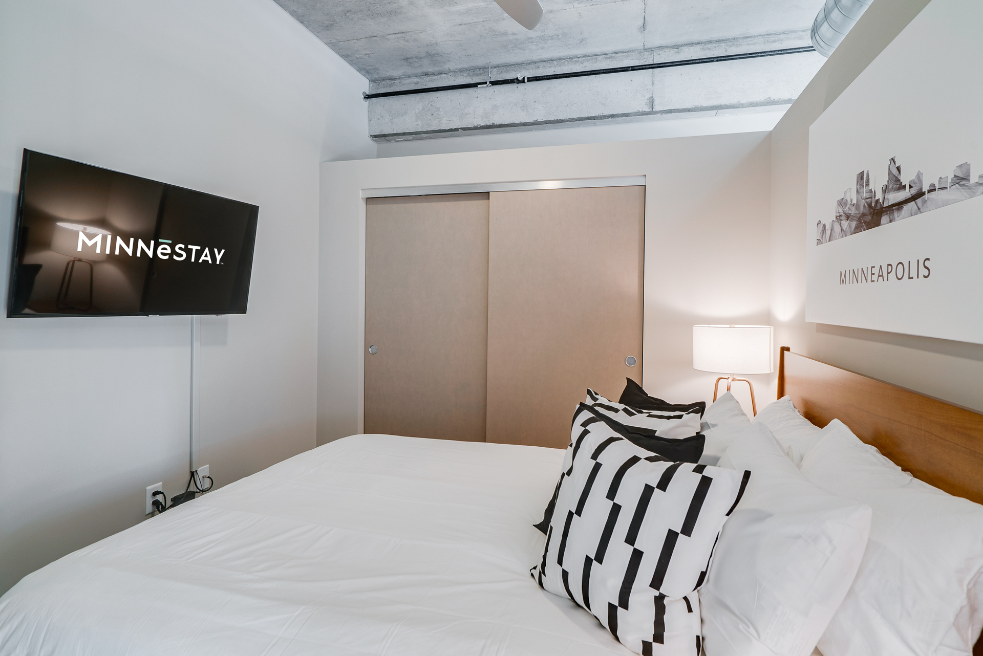 A contemporary bedroom featuring a cozy aesthetic with modern elements.