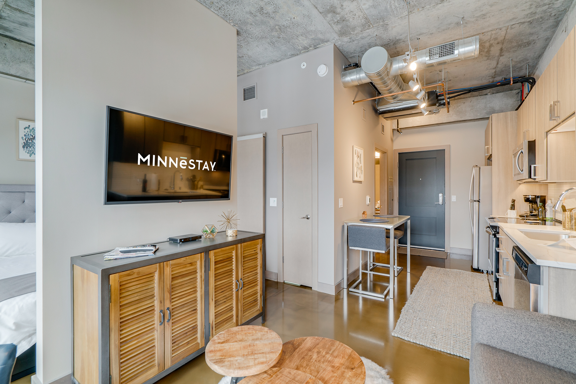 Modern studio apartment featuring sleek design elements and functional spaces.