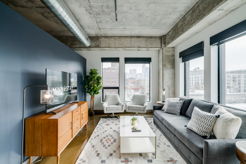A stylish and modern living room with city views.