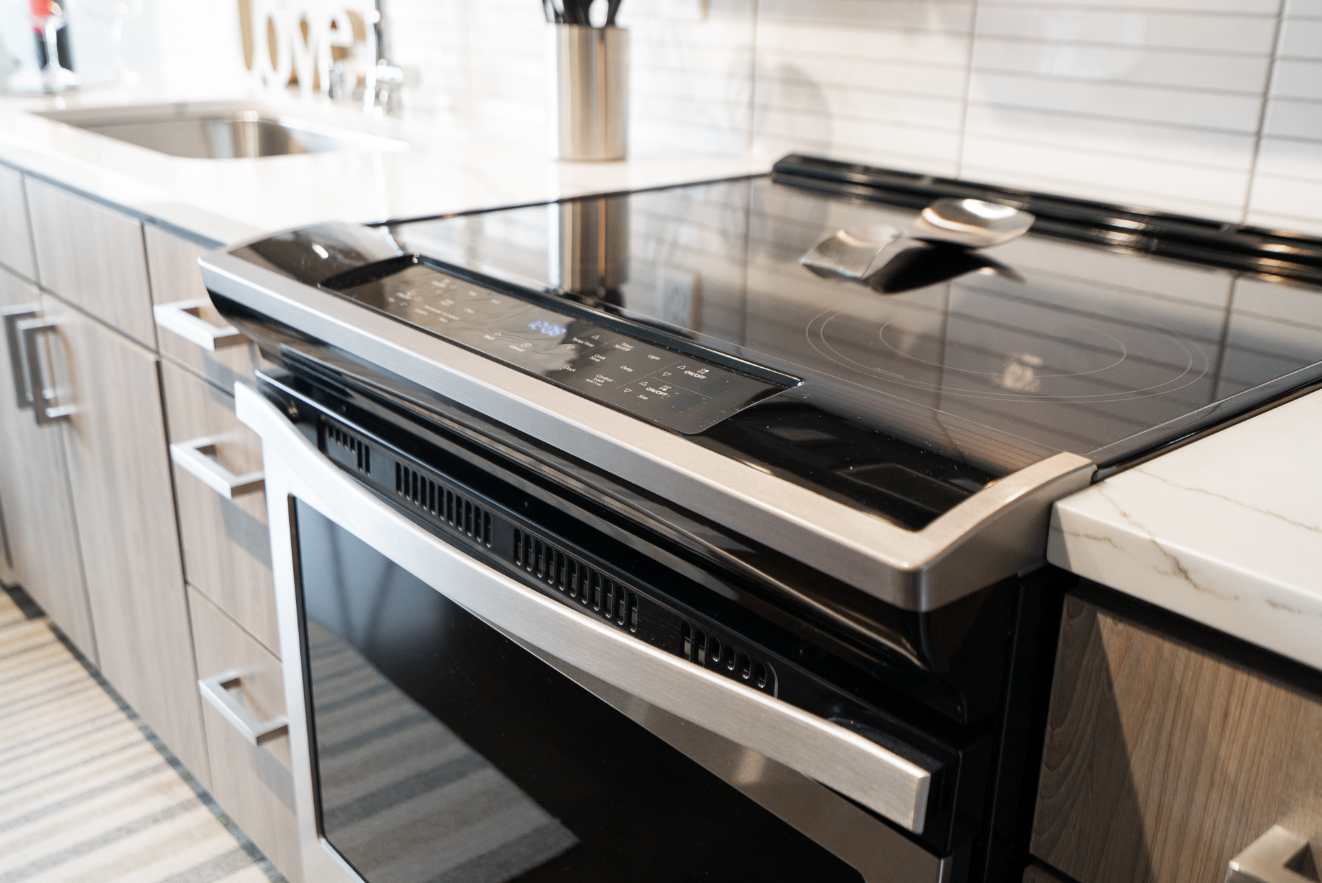 A sleek modern electric range in a stylish kitchen.