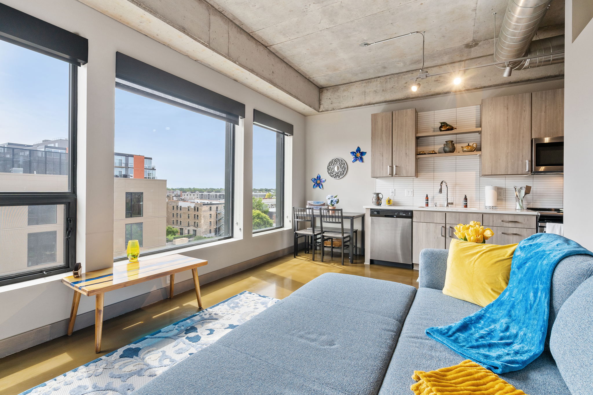 A modern apartment interior featuring a cozy living area and stylish kitchen.