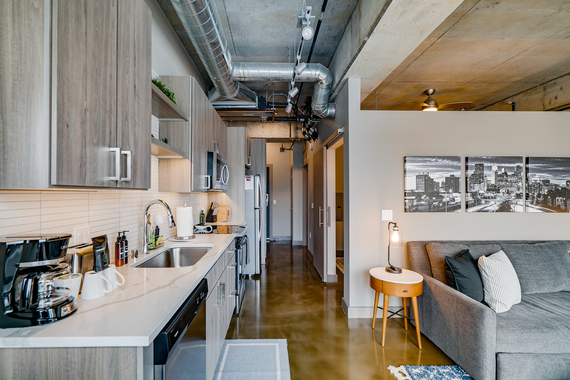 A contemporary apartment featuring a stylish kitchen and cozy living area.