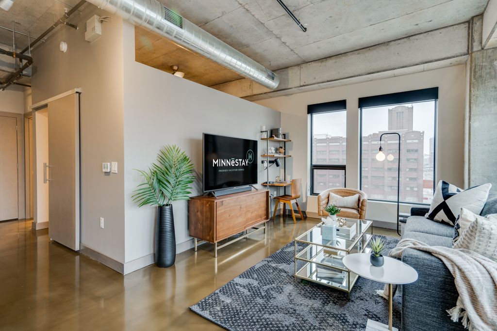 A contemporary living space with modern decor and urban views.