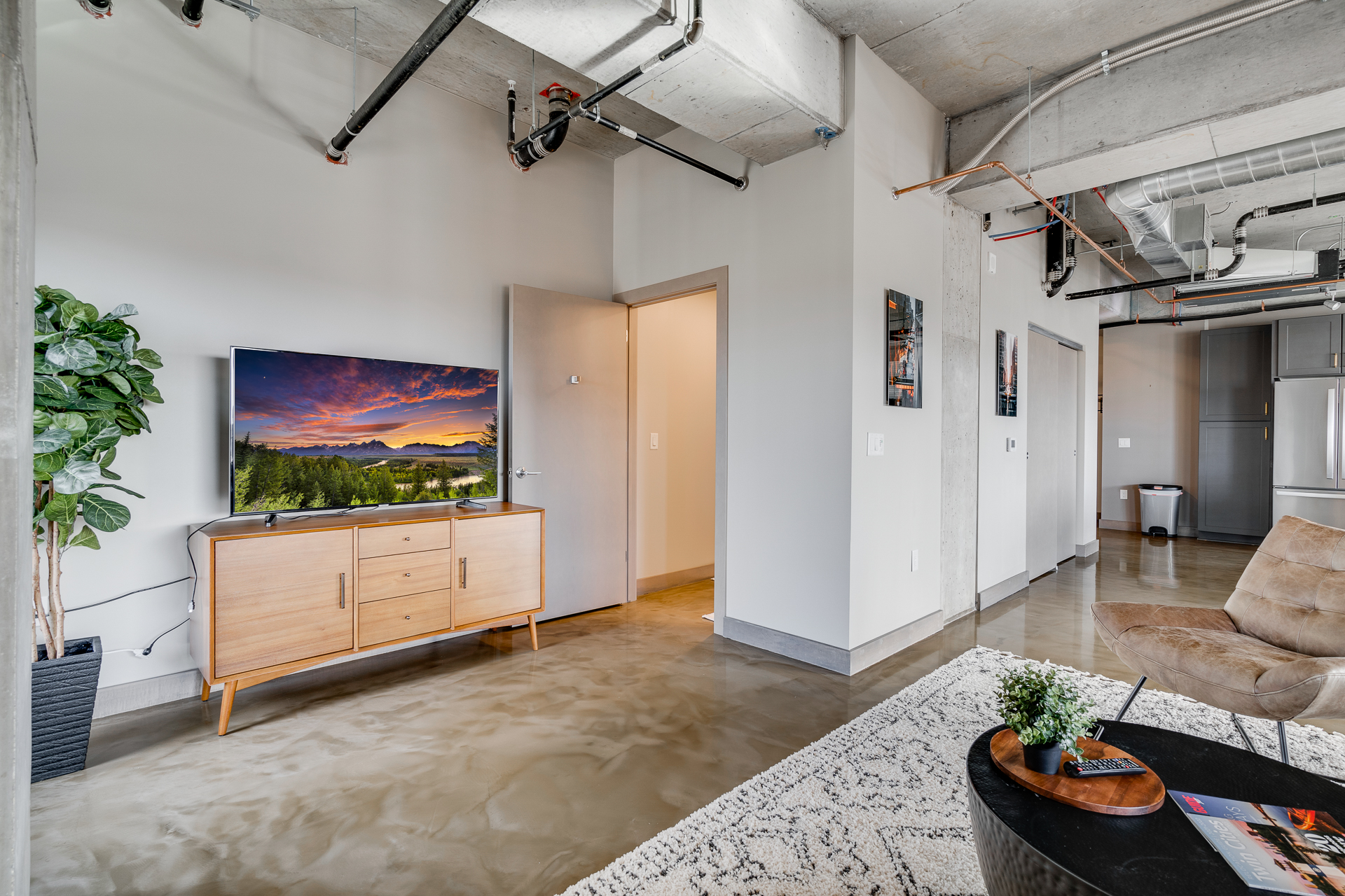 A stylish contemporary living room featuring modern furniture and thoughtful decor.