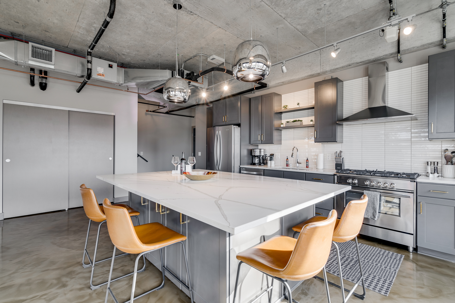A modern kitchen featuring a stylish island and sleek design elements.