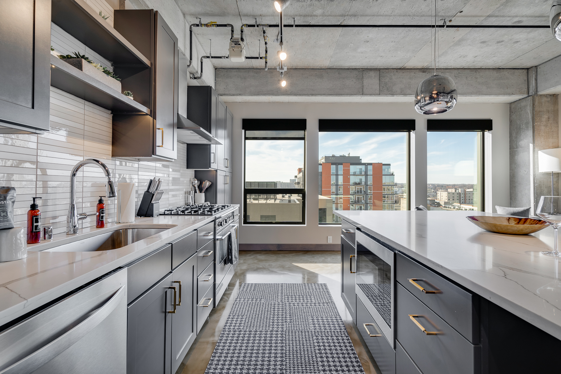 Modern kitchen with urban views and stylish décor.