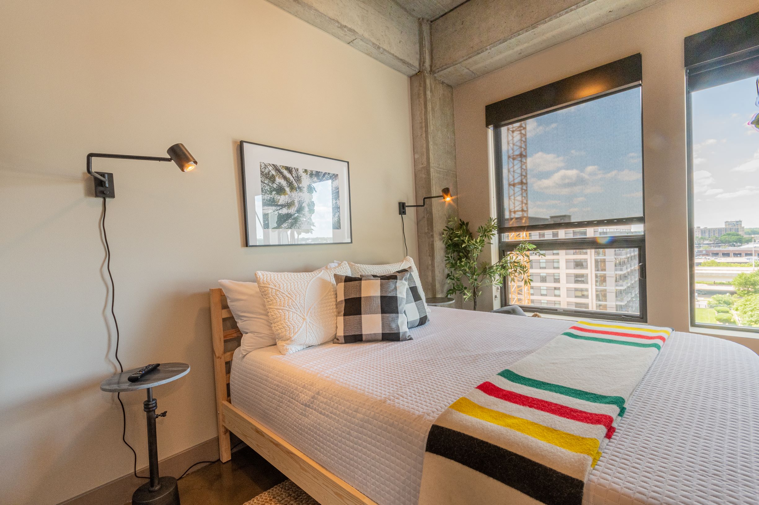 A stylish bedroom with modern decor and a cozy atmosphere.