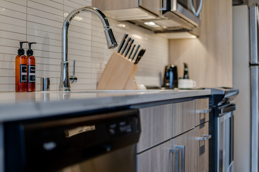 A modern kitchen with sleek appliances and stylish decor.