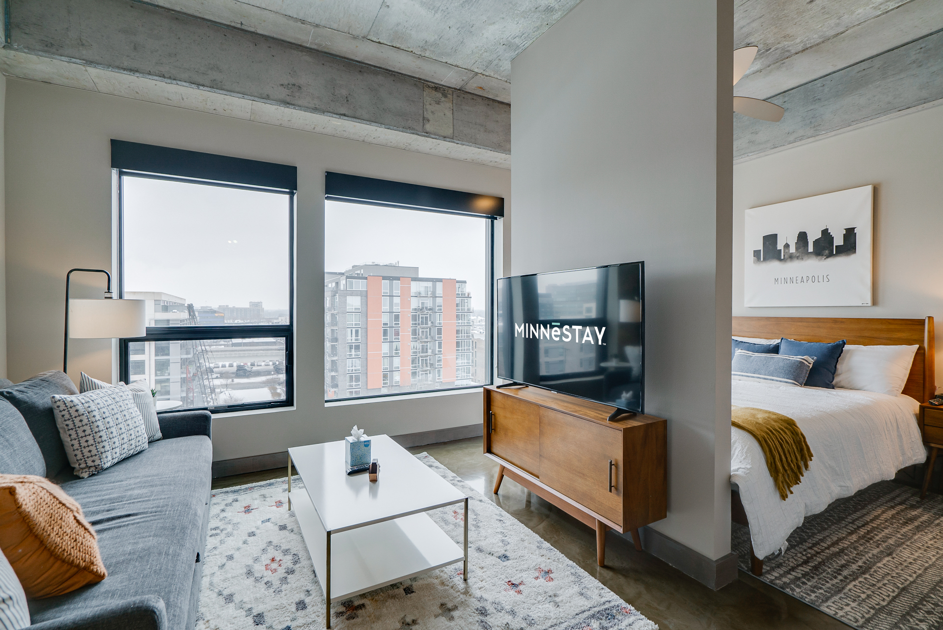 A stylish studio apartment featuring a modern design and cozy decor.