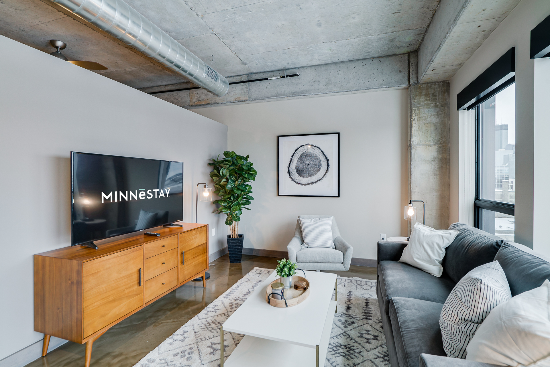 A chic and modern living room with an industrial touch.