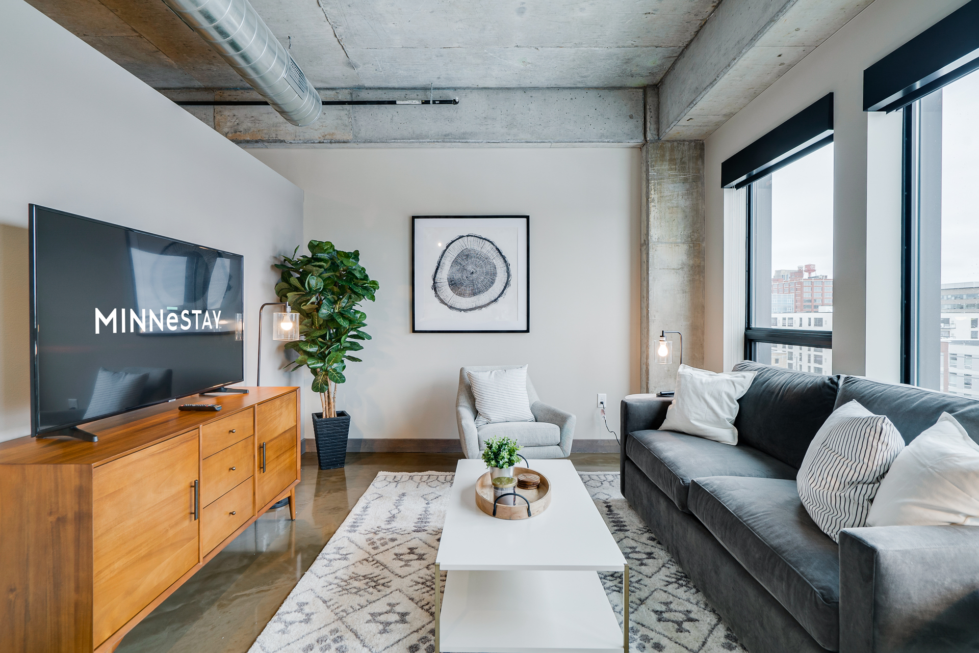 A modern living room featuring stylish decor and natural light.