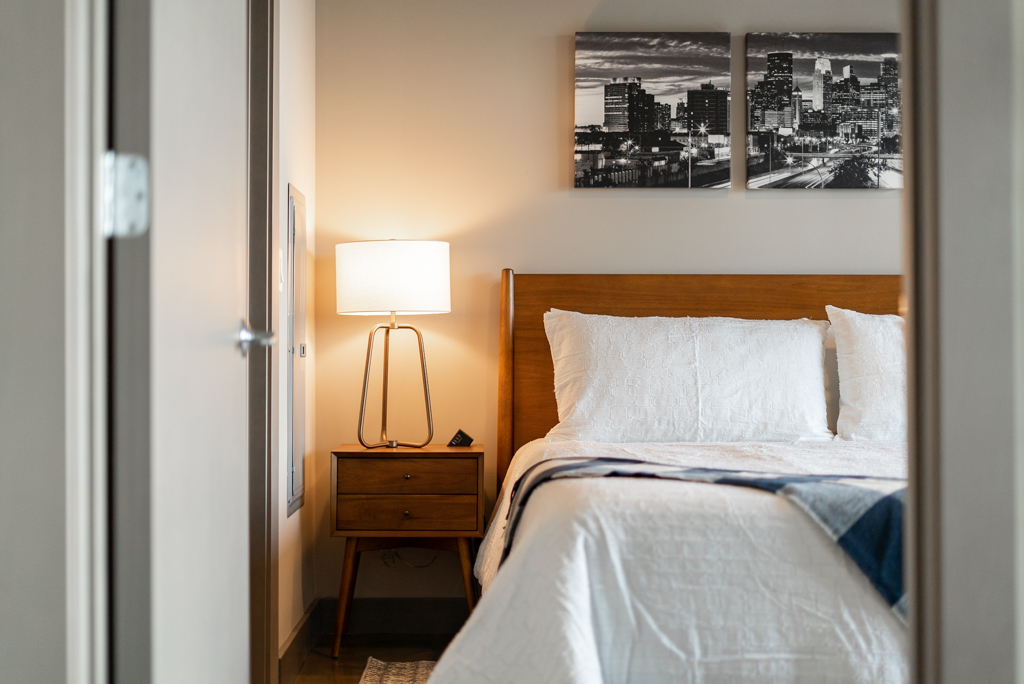 A cozy and modern bedroom with a minimalist design.