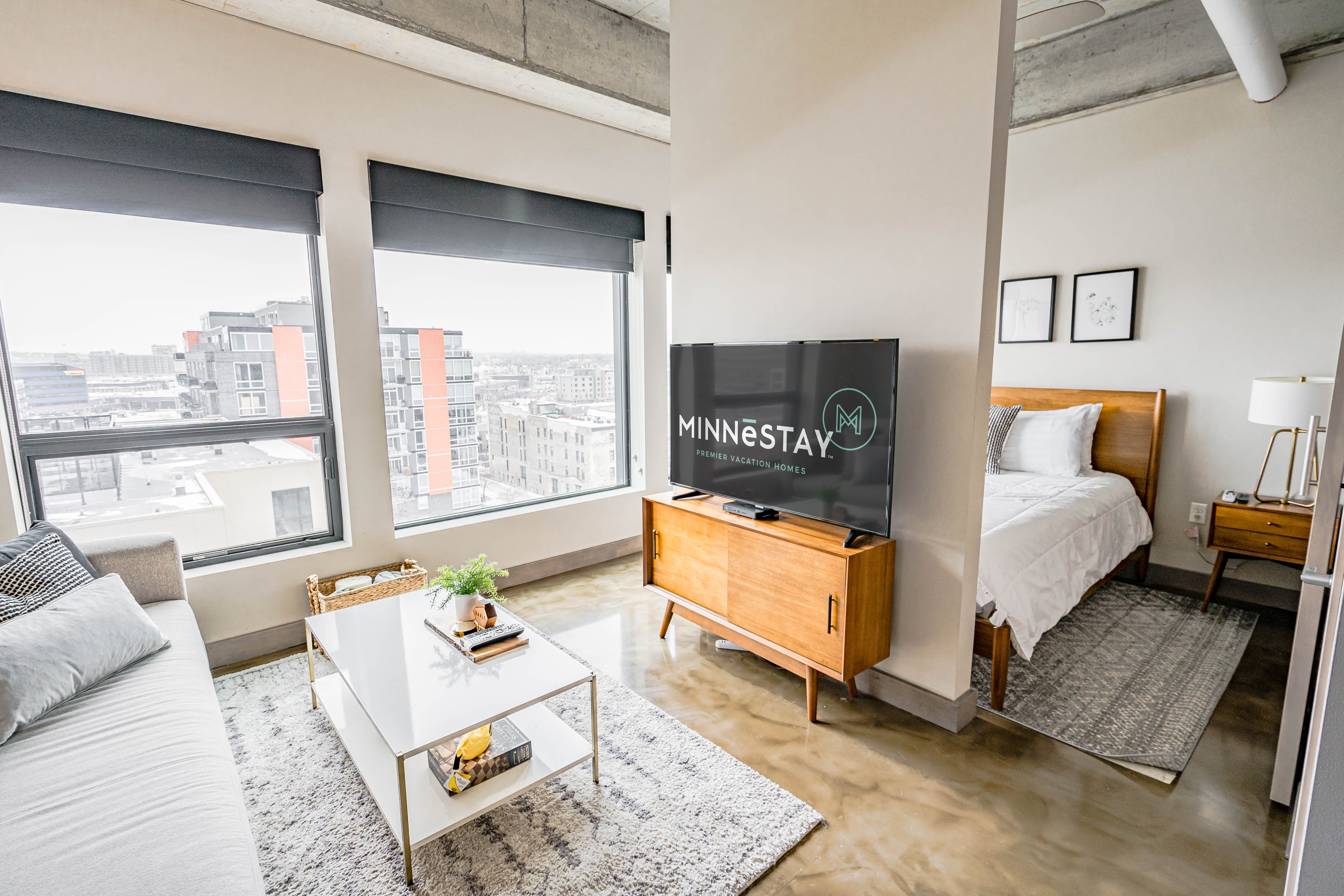 A modern studio apartment featuring an elegant design and city views.