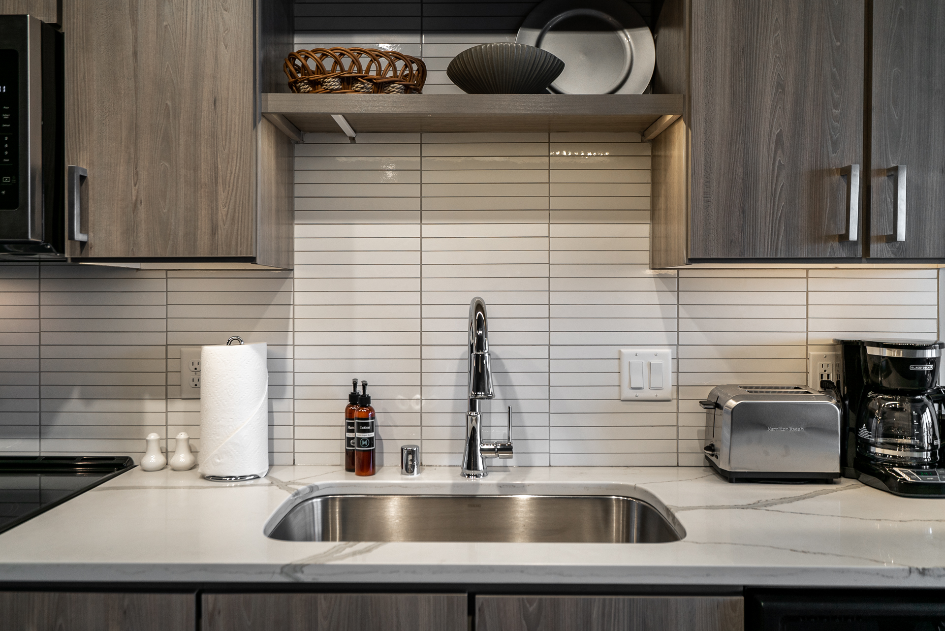 Contemporary kitchen countertop with sleek fixtures and minimalist design.