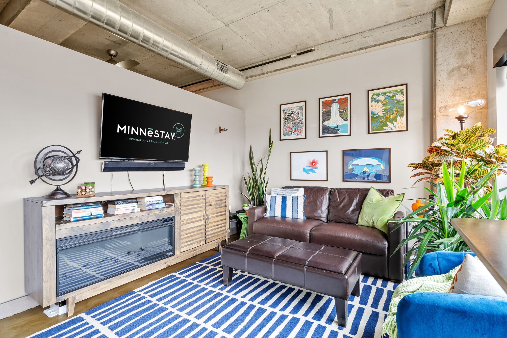 A cozy and stylish living room with modern decor and vibrant artwork.