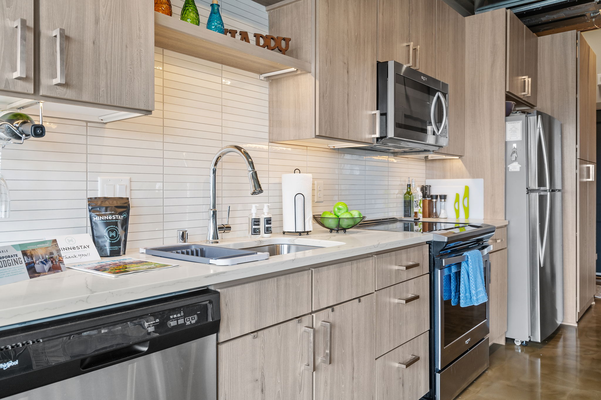 A modern kitchen with sleek appliances and vibrant decor.